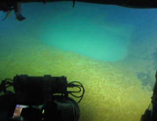 Illustration for article titled Opalescent Pools of Carbon Dioxide Curl Around an Underwater Volcano